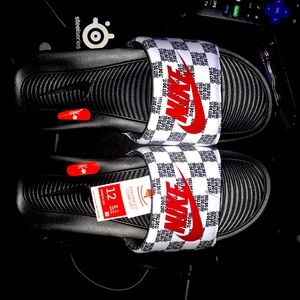 Size 12 black bottom red and white Nike slides